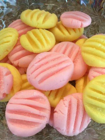 bowl of pink and yellow candies