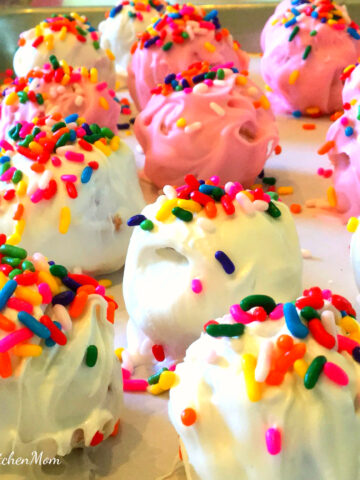 pink and white cake balls with sprinkles