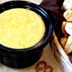 crockpot filled wit cheese sauce