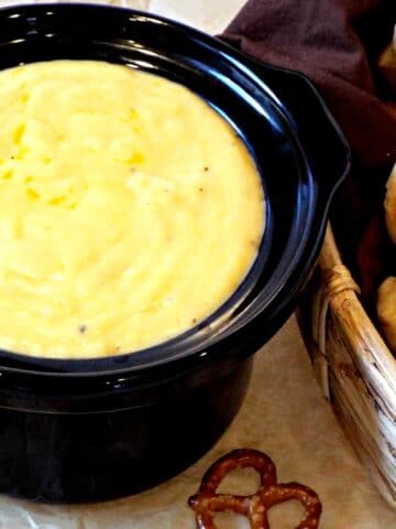 crockpot filled wit cheese sauce