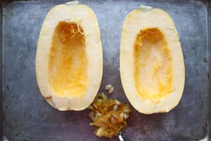 Spaghetti squash cut in half with seeds removed