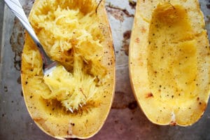 Spaghetti squash with fork removing the flesh