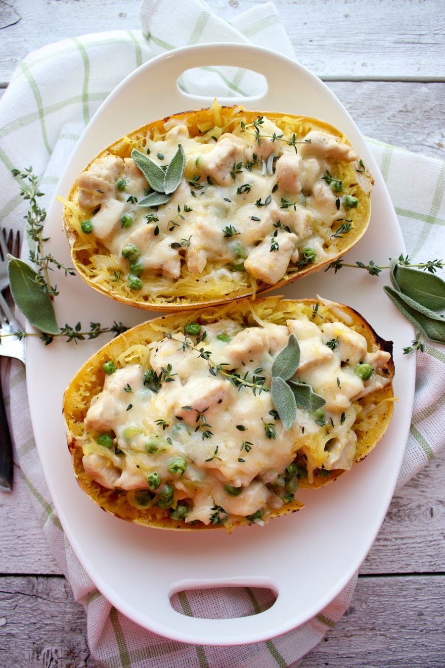 top view of Spaghetti squash in white dish with herbs