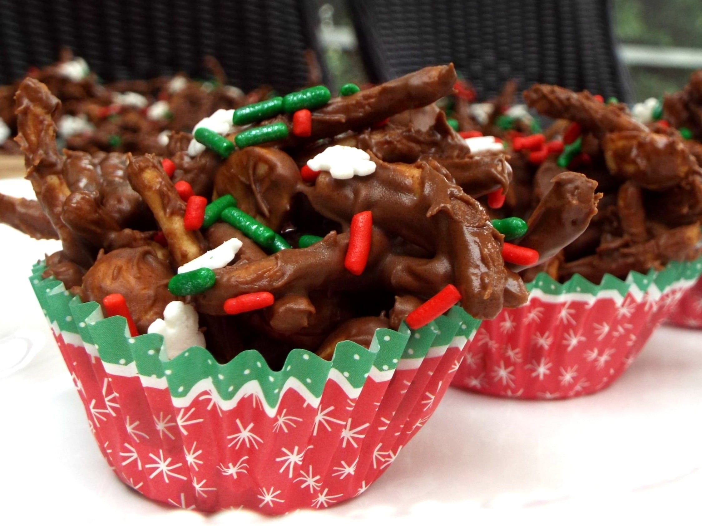 chocolate candy with sprinkles in a Christmas cupcake paper