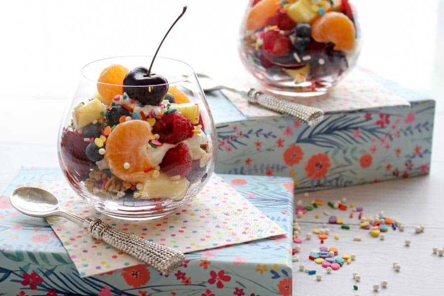 Breakrast Fruit Salad in a jar on a flowered box