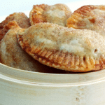 a basket filled with small apple hand pies