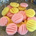 bowl of pink and yellow candies