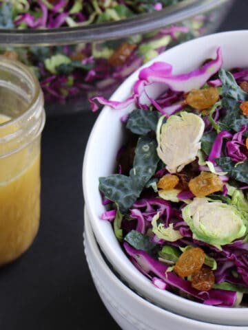 Shaved Brussels Sprout Kale Salad bowl with dijon vinaigrette