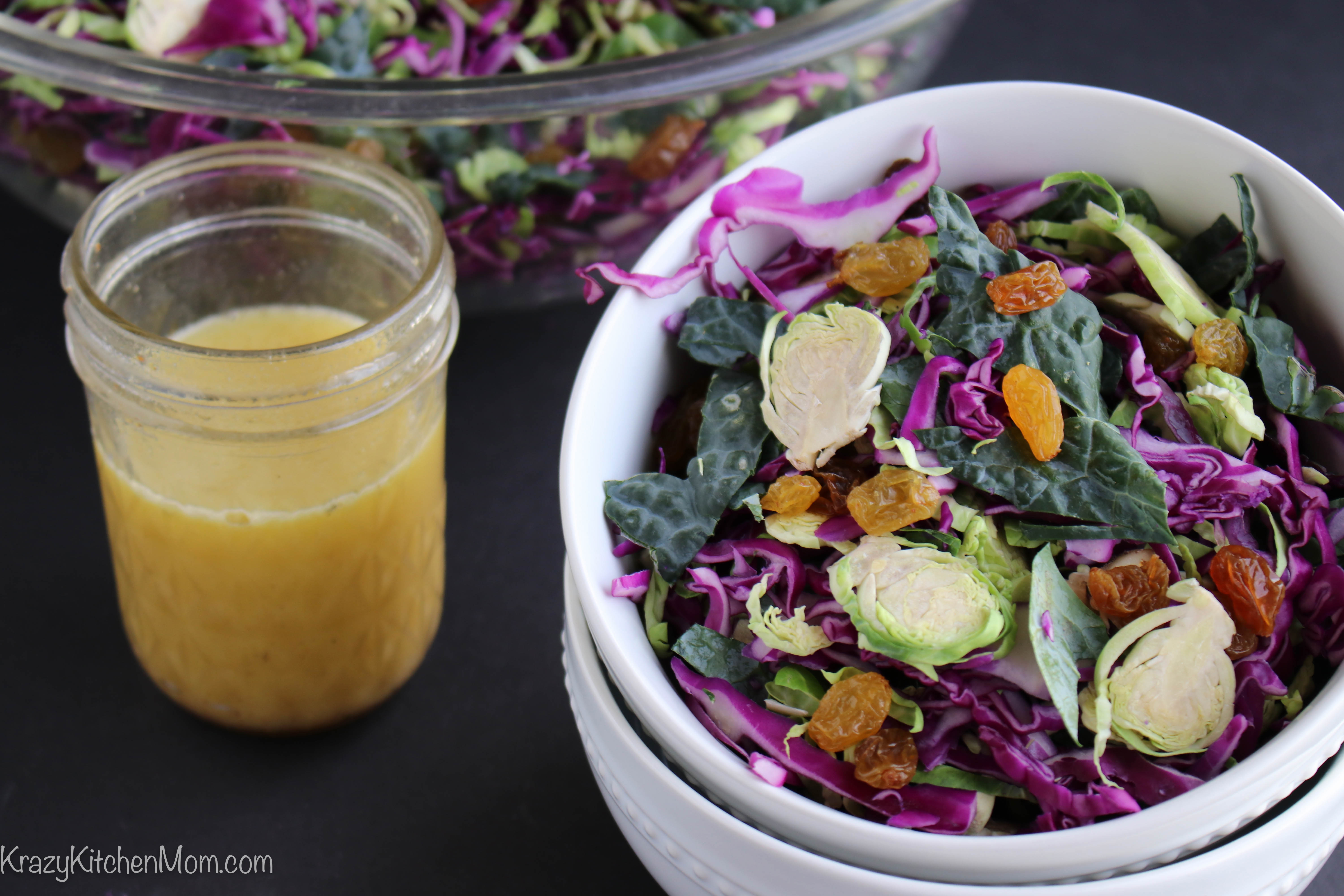 Shaved Brussels Sprout Kale Salad bowl with dijon vinaigrette 