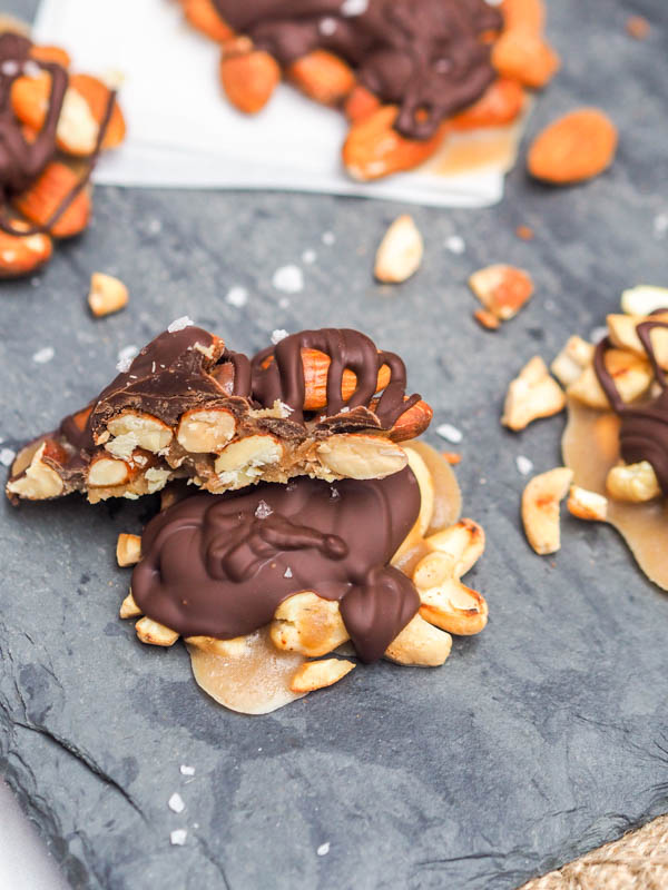 A chocolate turtle candy on a gray board