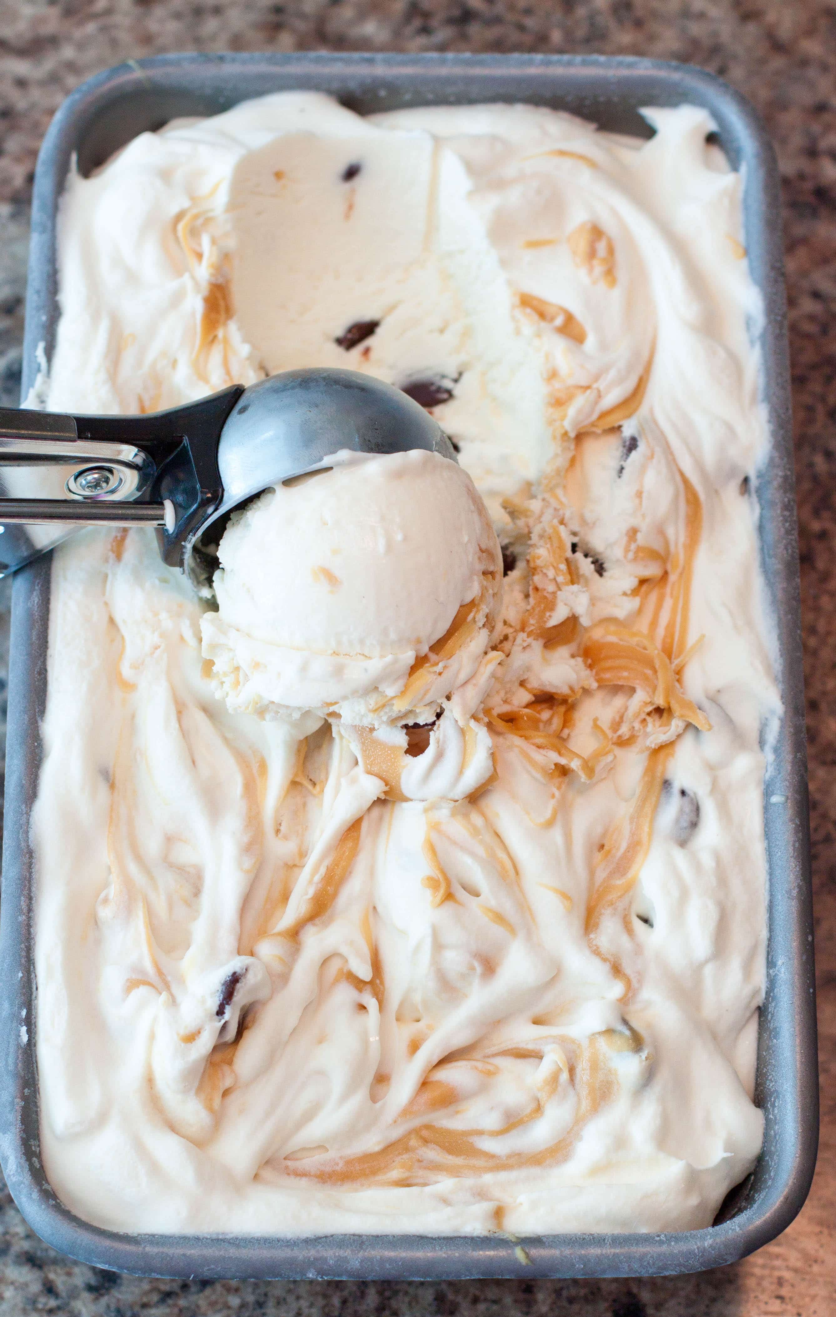  Caramel ice cream being scooped out of container