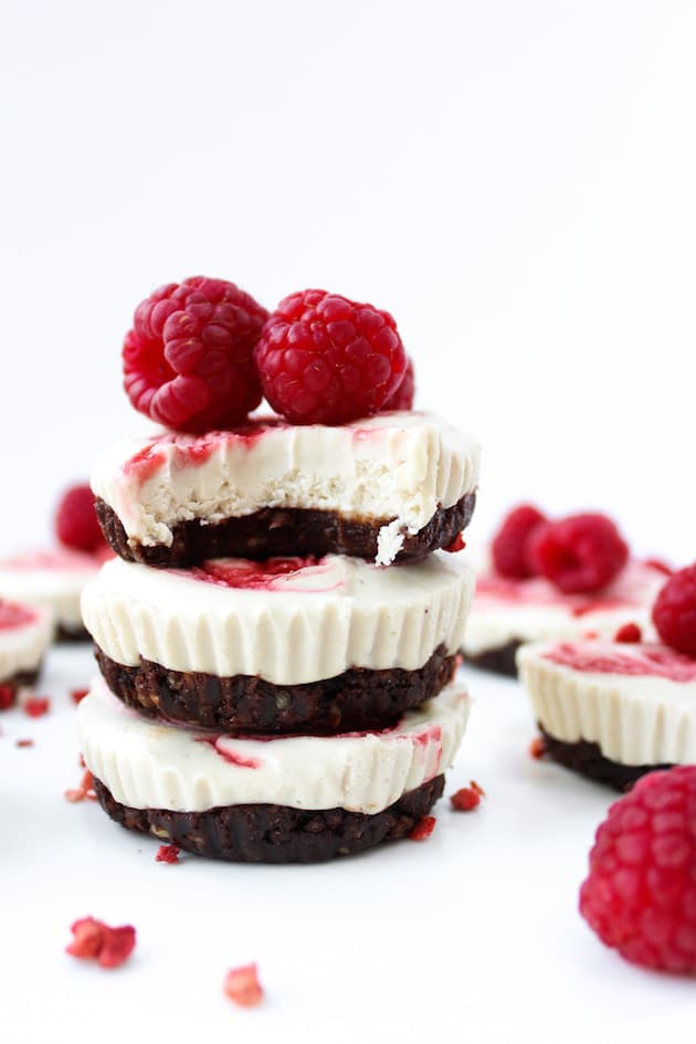 a stack of three Cheesecakes topped with Raspberries