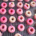 These Mini Pink Lemonade Donuts are baked and glazed with fresh lemon juice and confectioners sugar.