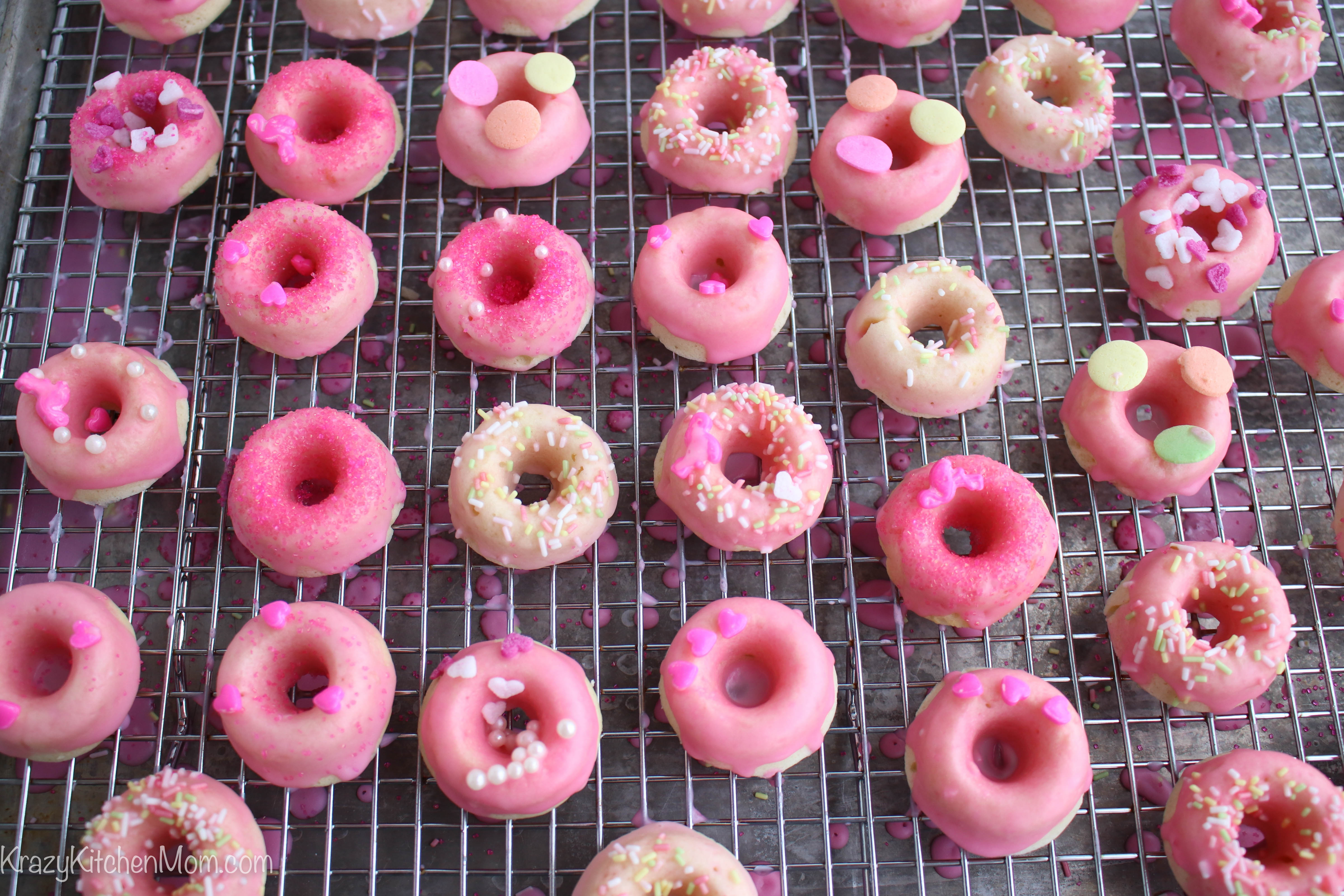 These Mini Pink Lemonade Donuts are baked and glazed with fresh lemon juice and confectioners sugar.