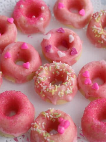 These Mini Pink Lemonade Donuts are baked and glazed with fresh lemon juice and confectioners sugar.