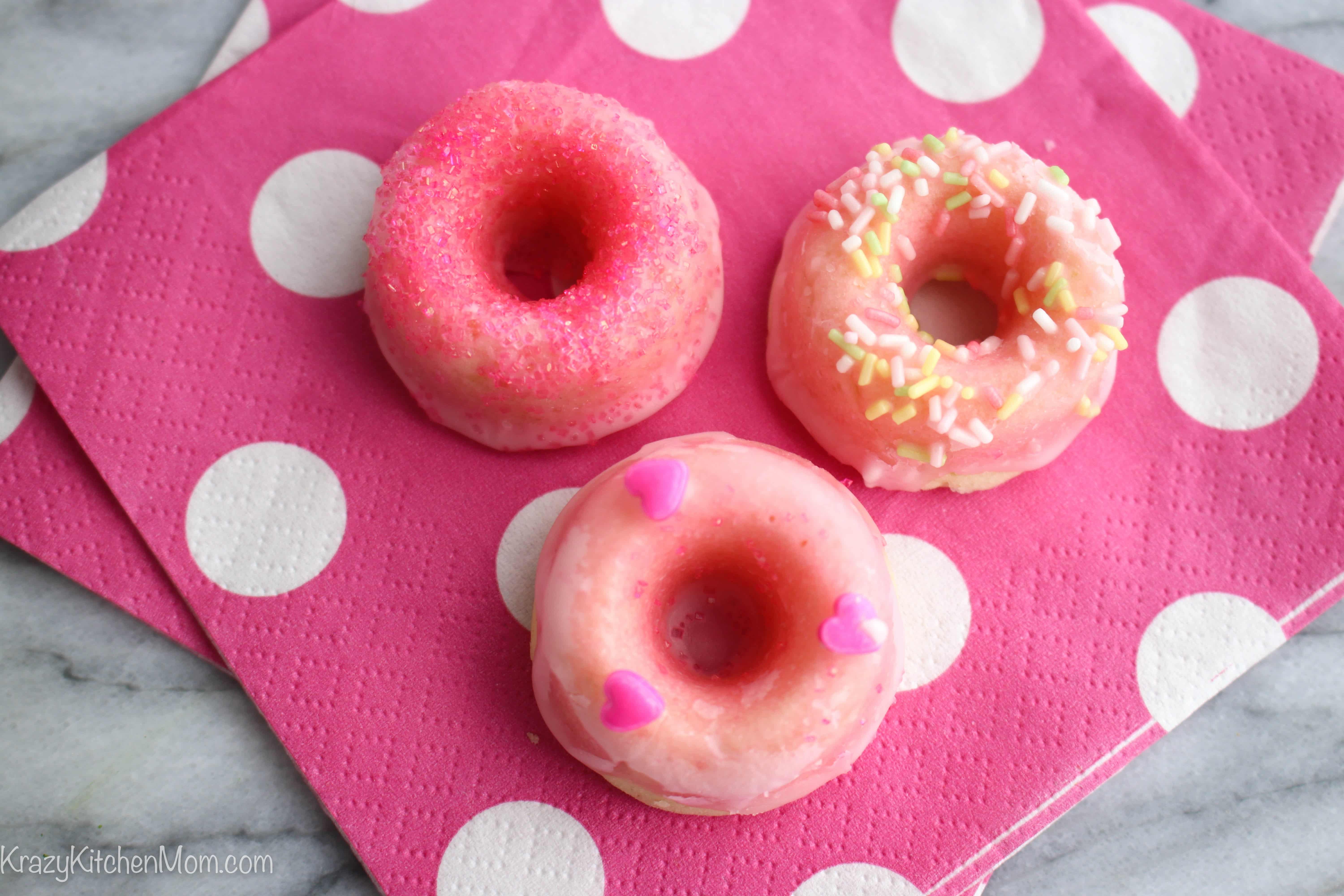 These Mini Pink Lemonade Donuts are baked and glazed with fresh lemon juice and confectioners sugar.