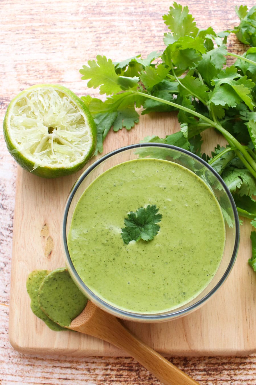 Cilantro Lime Sauce with cilantro and lime close up