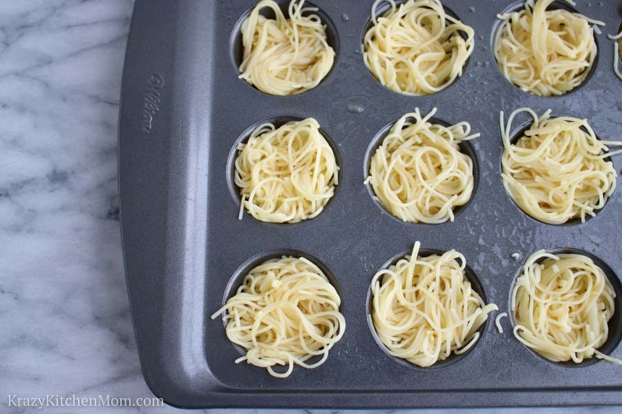 Pasta nests in a small muffin tin