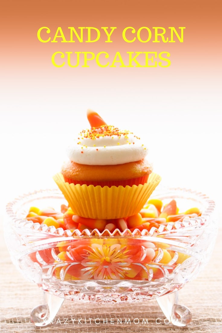 Candy Corn Cupcakes are a fun way to celebrate Halloween and Fall. Just one cake mix, two colors and cream cheese frosting and everyone loves them. via @krazykitchenmom