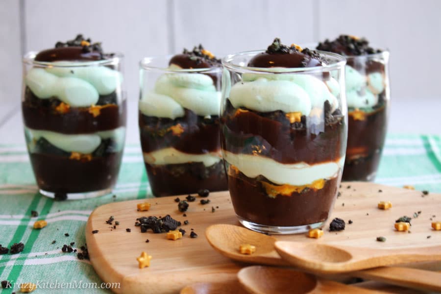 four Parfaits filled with chocolate cake and mint mousse and little gold stars