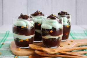 four Parfaits filled with chocolate cake and mint mousse and little gold stars