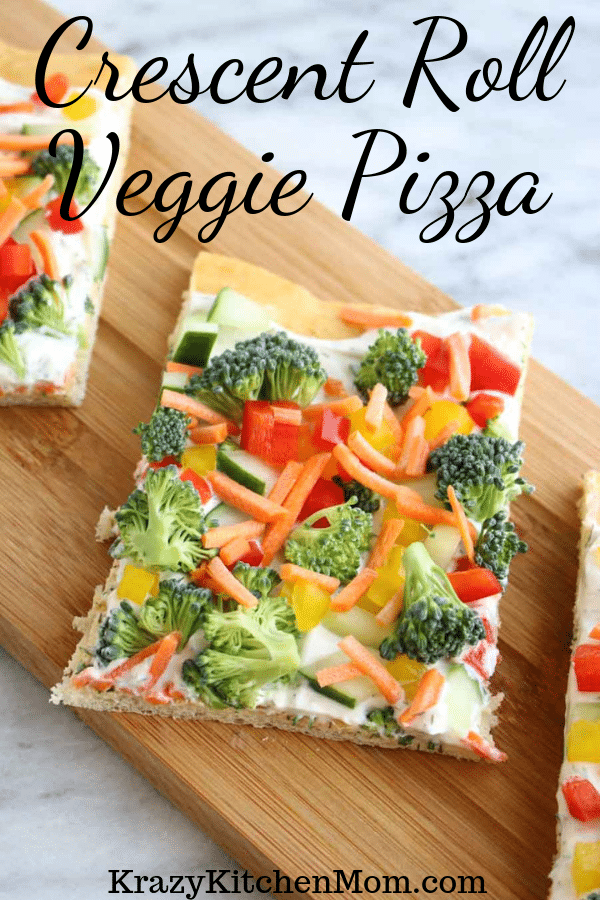 Crescent Roll Veggie Pizza a fresh way to eat veggies. It's made with refrigerator crescent roll dough, homemade dill dip and lots of fresh vegetables. I'd say it's a summertime classic! via @krazykitchenmom