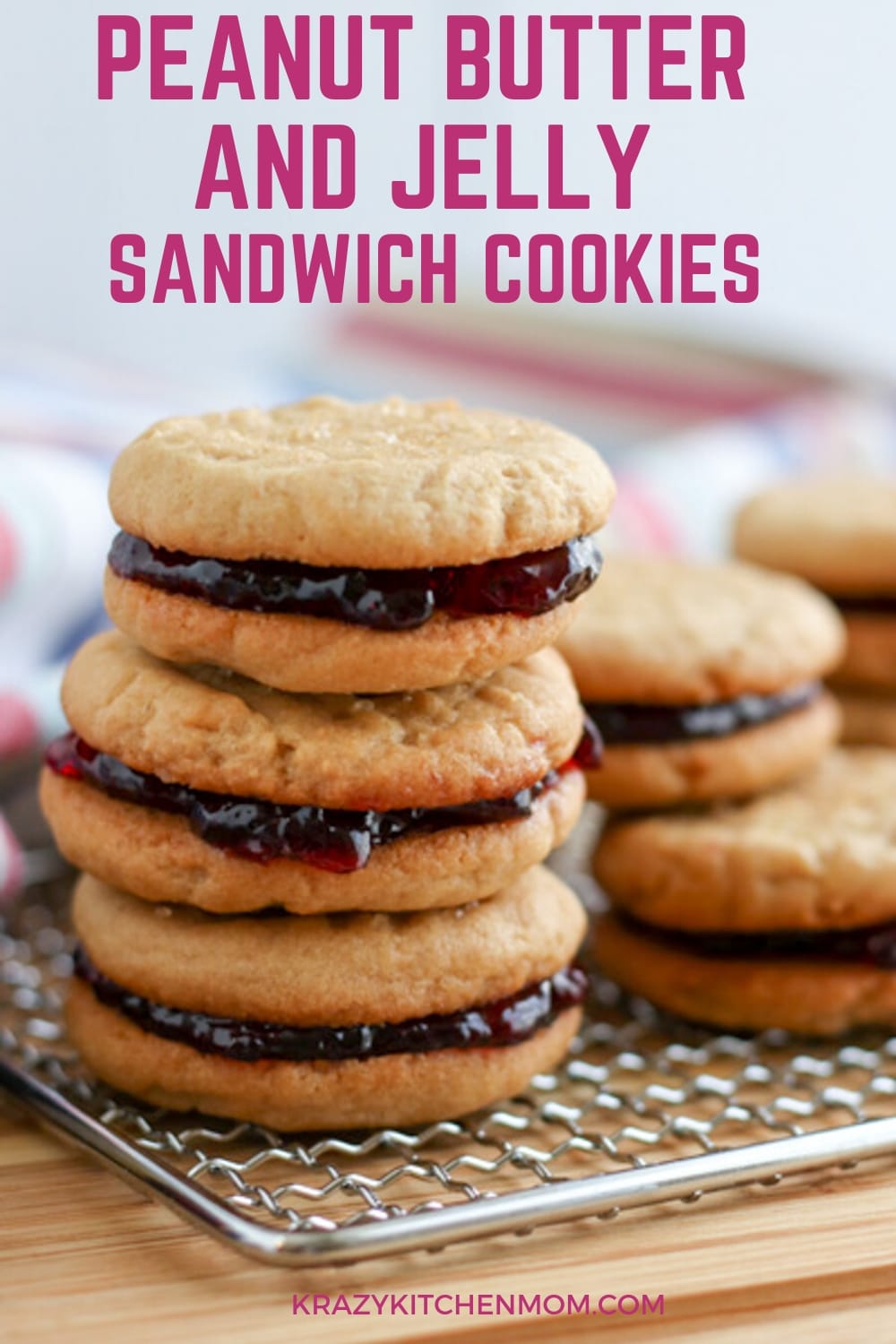 Two peanut butter cookies sandwiched together with grape jelly make the best Peanut Butter and Jelly Cookies. Crunchy, creamy, sweet - everything you remember in a delicious little three-bite cookie. via @krazykitchenmom