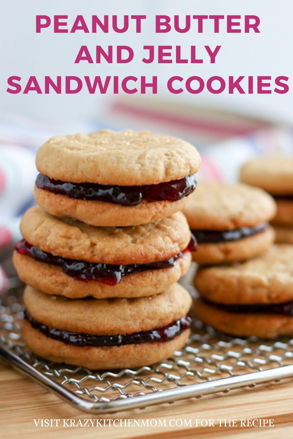 Two peanut butter cookies sandwiched together with grape jelly make the best Peanut Butter and Jelly Sandwich Cookies. via @krazykitchenmom