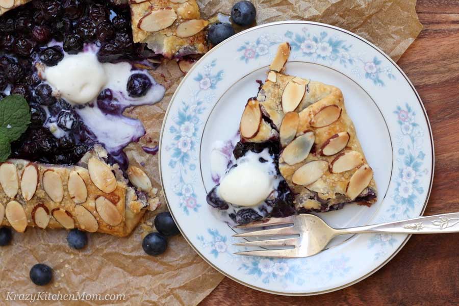 Slice of blueberry galette with ice cream