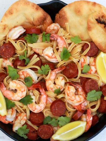 A plate of food, with Chorizo and Pasta