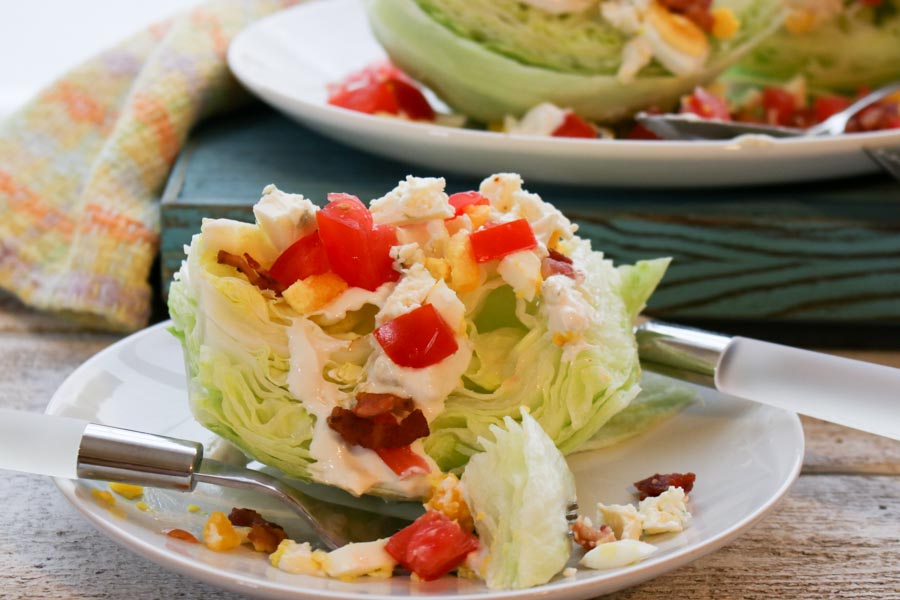 close up of the classic wedge salad with blue cheese dressing