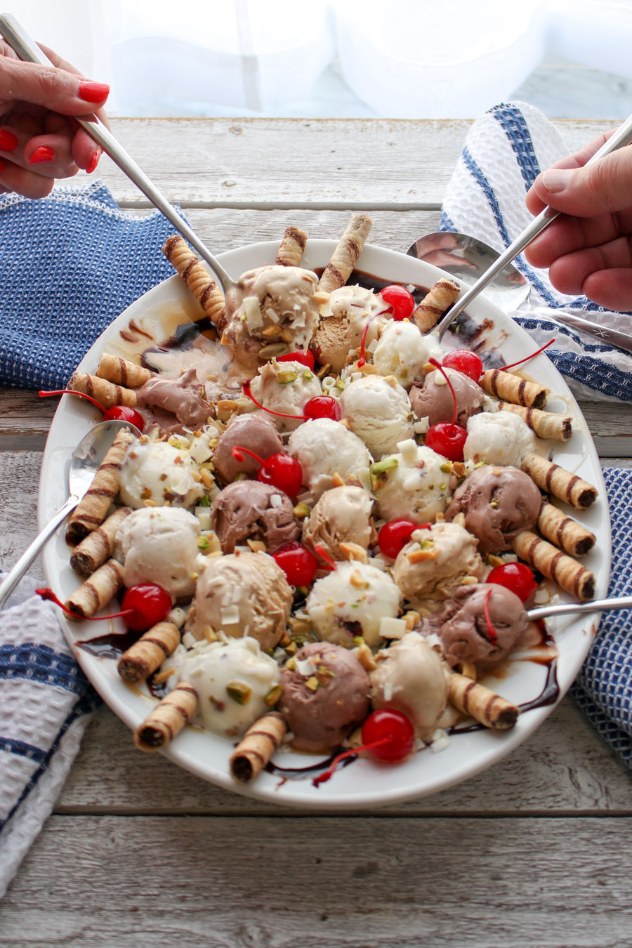 Ice Cream Party Platter with two hands holding spoons 