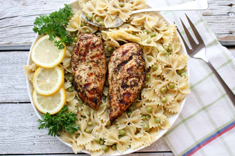 Two chicken breasts on pasta - overhead shot