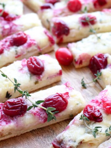 close up of three cheese cranberry flatbread slices