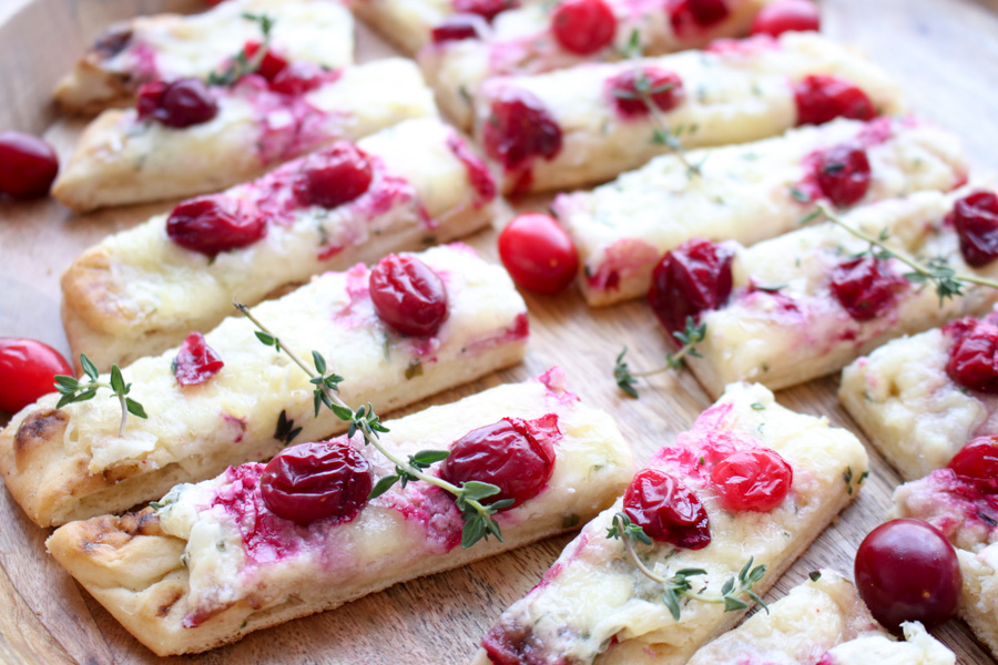 close up of three cheese cranberry flatbread slices