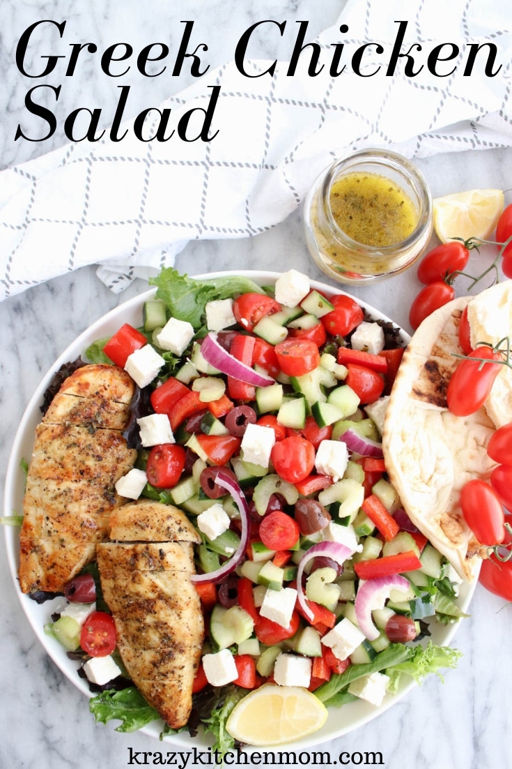 Greek Chicken Salad is made with leafy lettuce, feta cheese, olives, cucumbers, tomatoes, onion, bell peppers, and celery. It's topped with Greek seasoned grilled chicken and drizzled with Greek dressing. via @krazykitchenmom