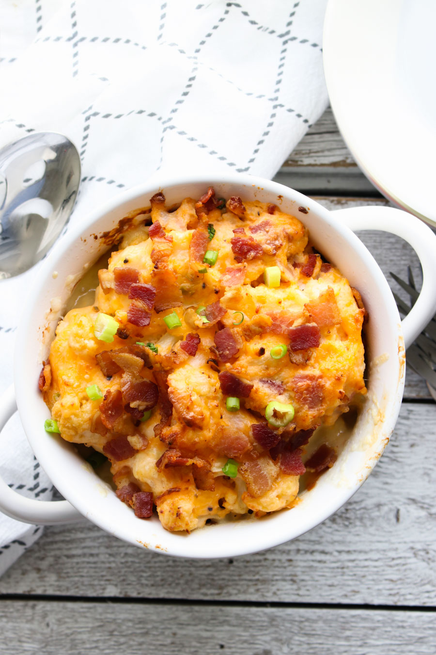 Loaded Cauliflower Casserole with spoon