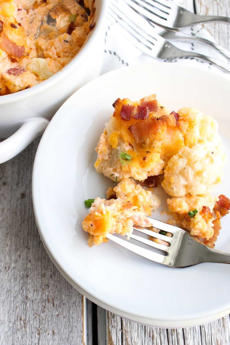 Loaded Cauliflower Casserole on a plate with a fork