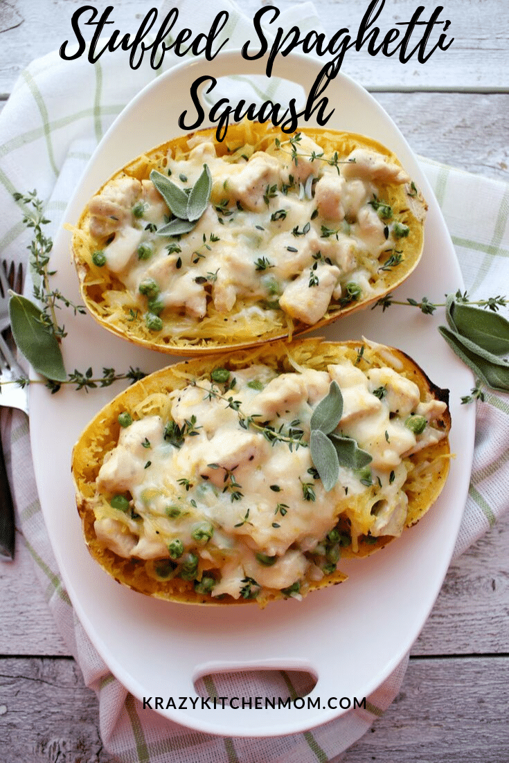 Low carb Stuffed Spaghetti Squash is full of chicken, peas, and fresh herbs all topped with nutty Gruyere cheese than baked to perfection. via @krazykitchenmom