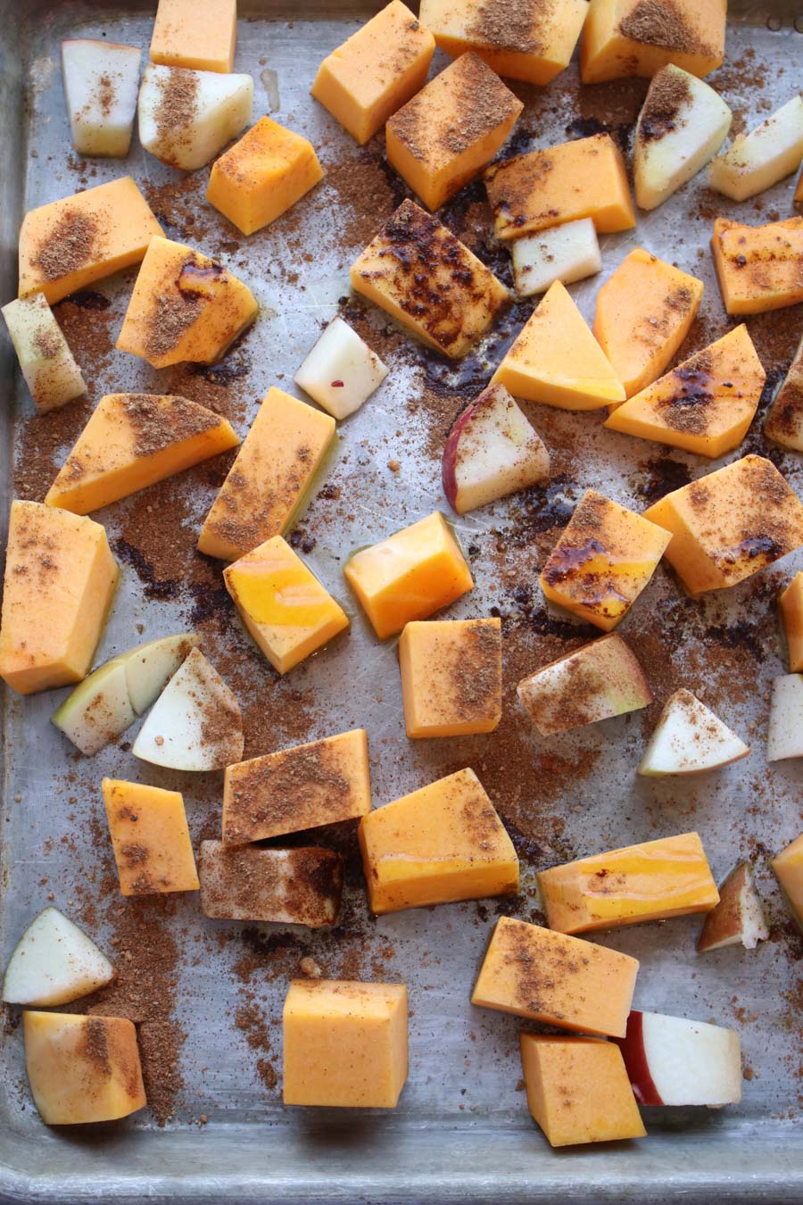 diced squash and apples on roasting pan