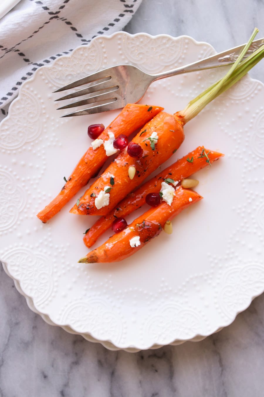 Carrots cut in half on a plate