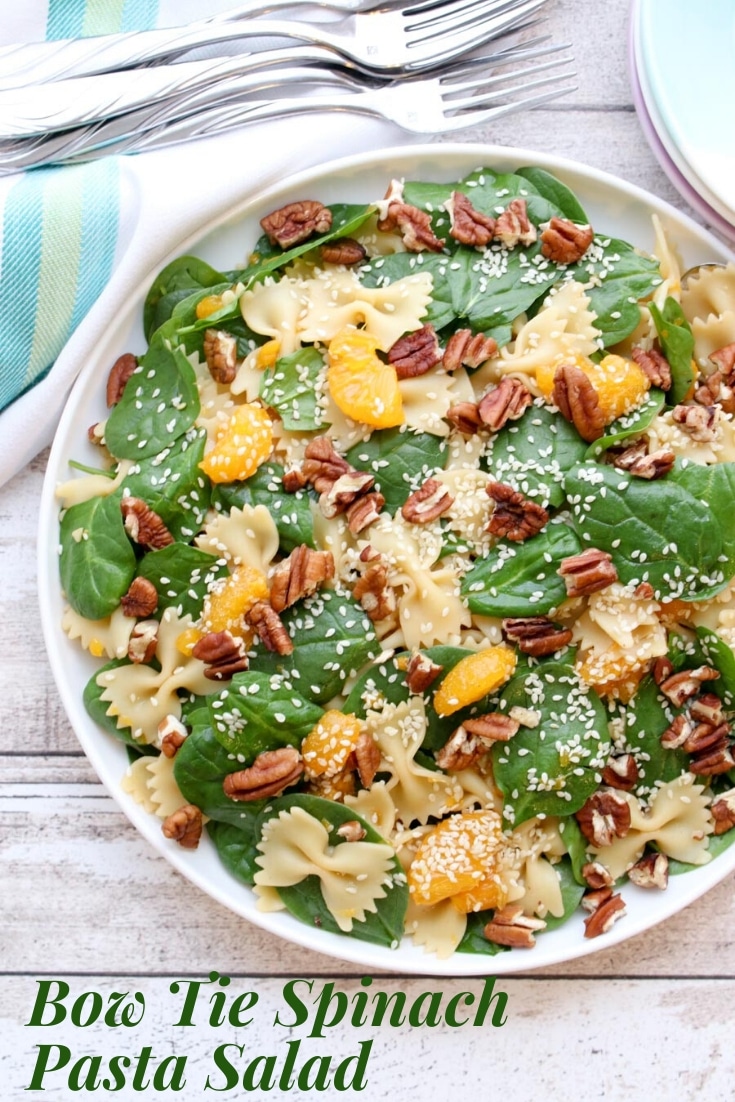 Bow Tie Spinach and Pasta Salad is made with Farfalle pasta, fresh baby spinach, mandarin oranges, and toasted walnuts with an Asian ginger dressing.  via @krazykitchenmom