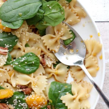 Spinach salad with serving spoon