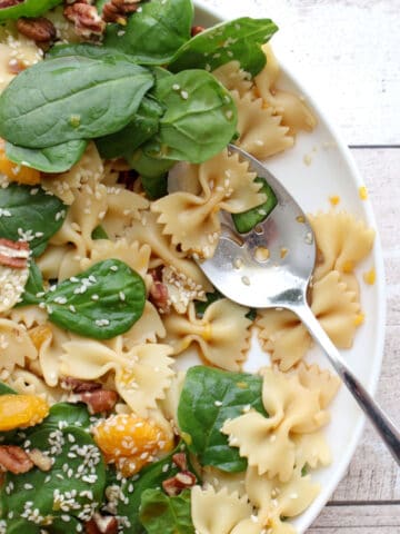 Spinach salad with serving spoon