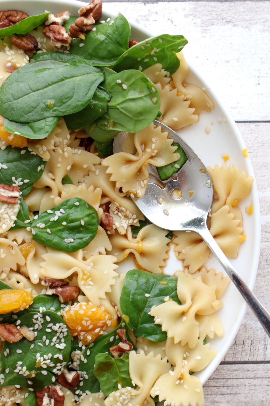 Spinach salad with serving spoon