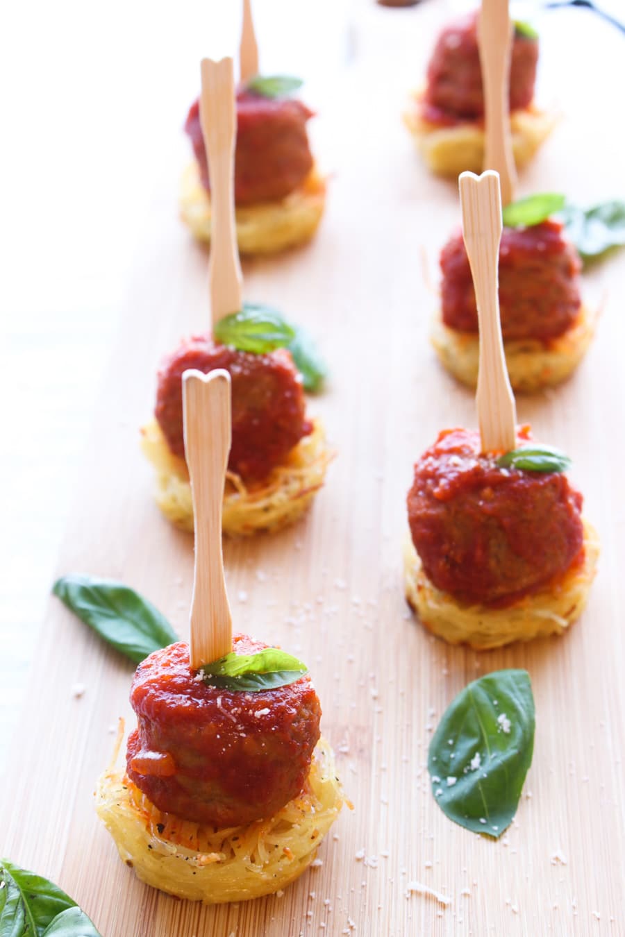 Spaghetti and meatballs on a board