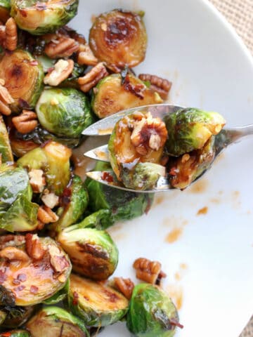 sprouts in a serving dish with a spoon