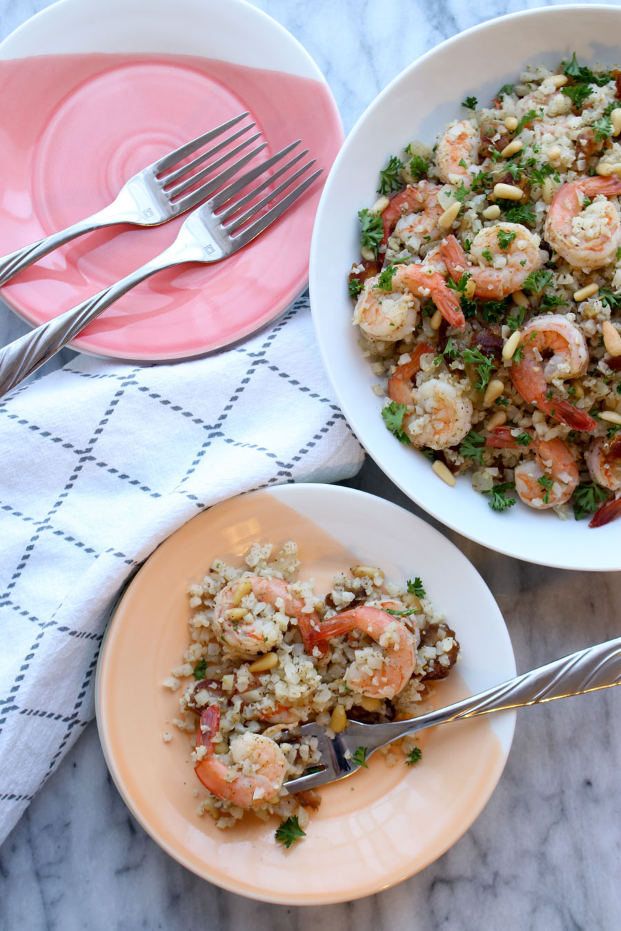 dish of shrimp and cauliflower rice and one serving on a plate