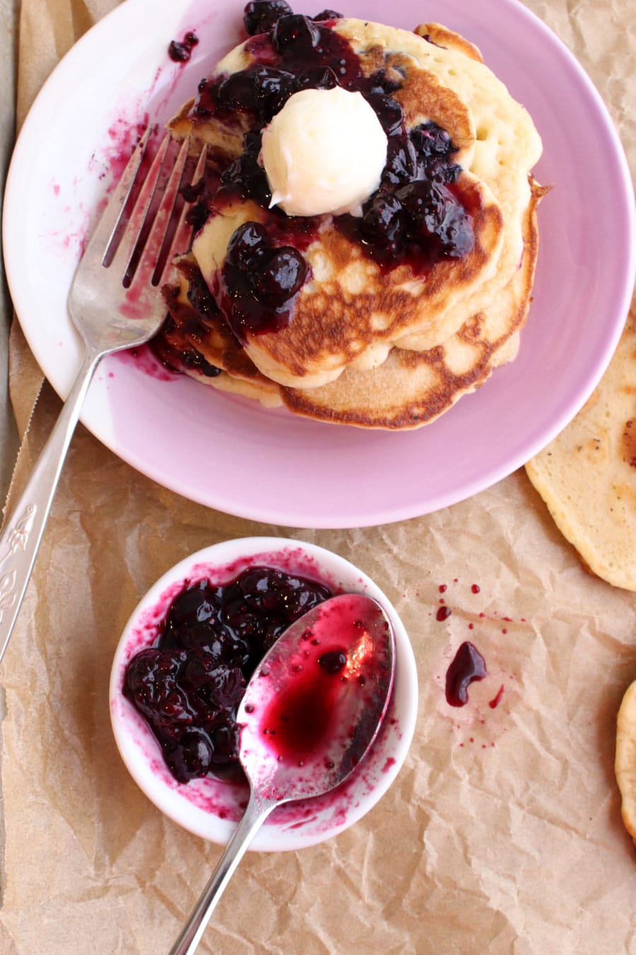 Plate of pancakes with a small dish of syrup