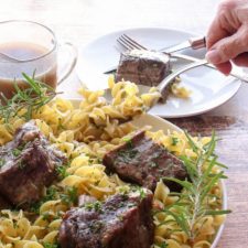 Noddles and ribs being served